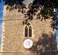 The outside of the bell tower showing clock face